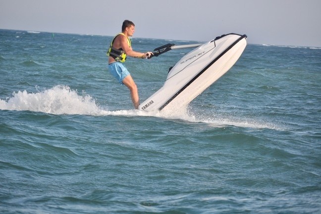 a man riding a wave on a surfboard in the ocean